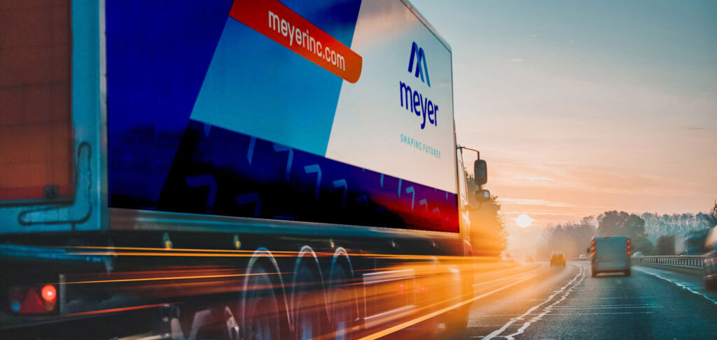 Meyer moving truck on the road supporting nationwide library relocation and collection moving services.