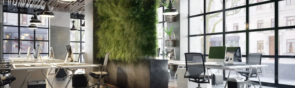 Modern open office workspace with desks, computers, and natural light, representing office relocation planning and timing