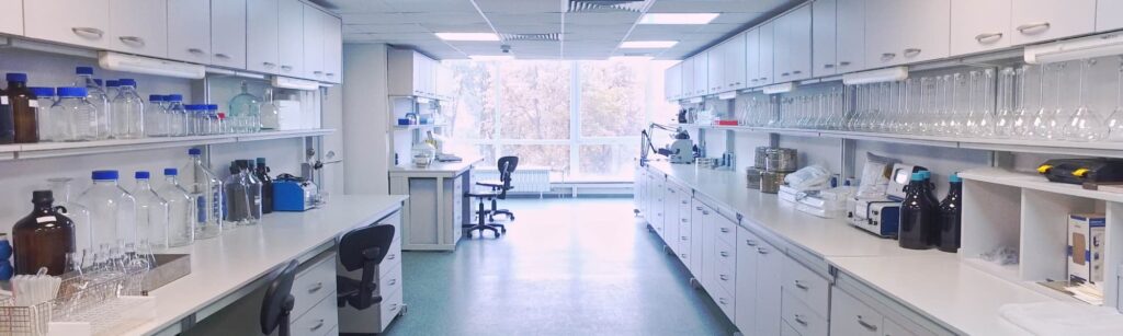 Modern laboratory workspace with equipment, glassware, and workstations, representing lab relocation planning and timeline